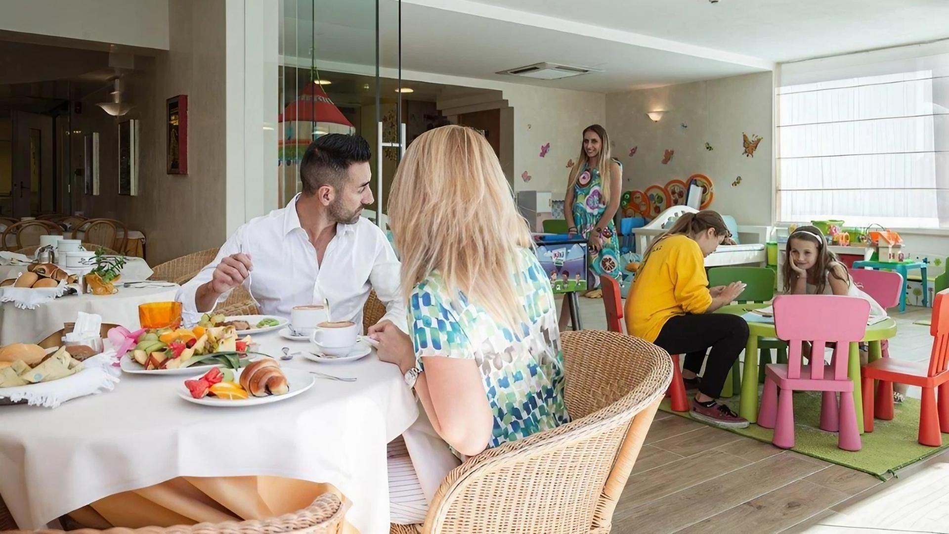 Family breakfast with children's play area.