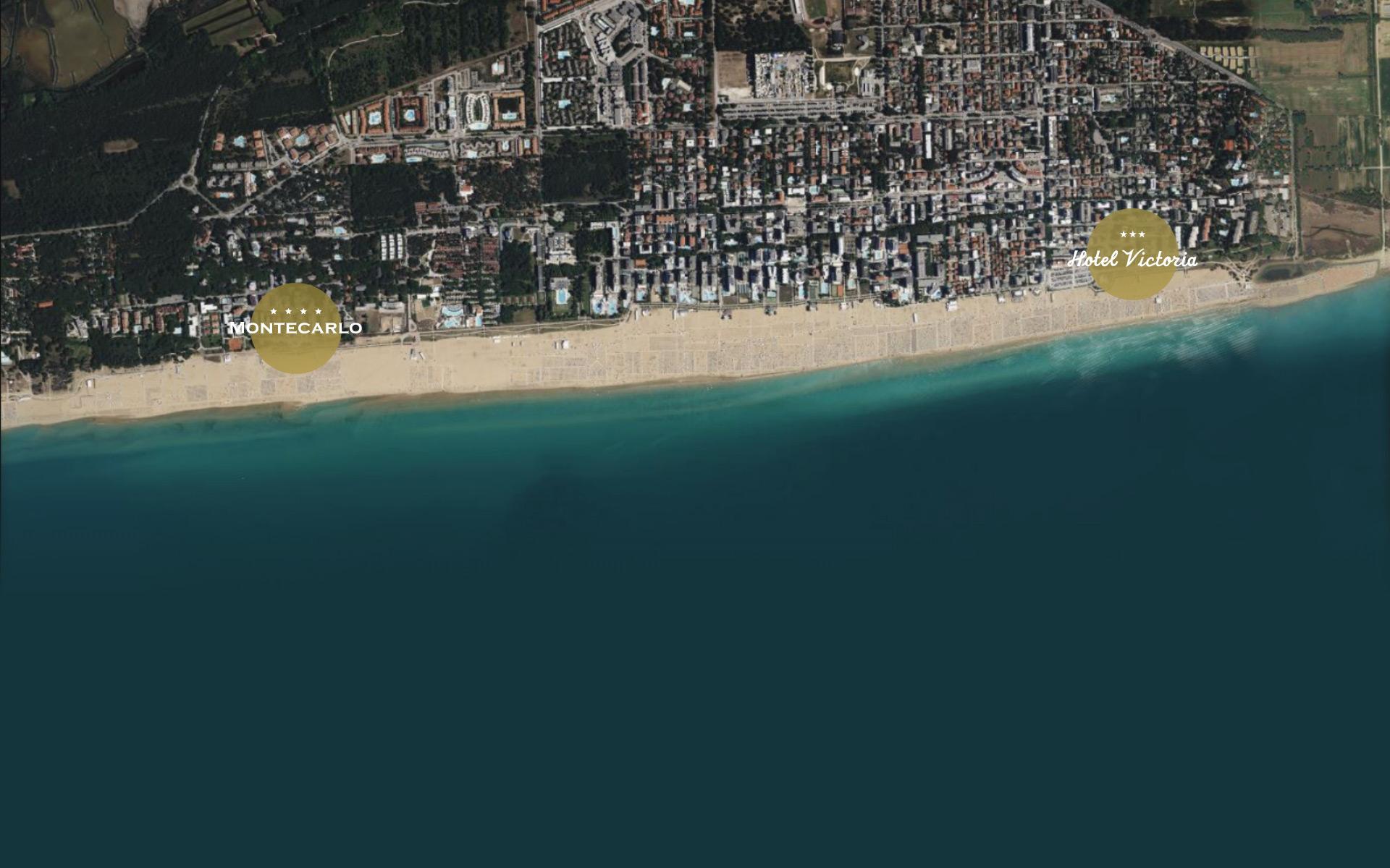 Aerial view of the coast with Montecarlo and Victoria hotels.